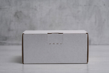 Eco friendly packaging sustainable shipping box on light background. Simple and sturdy packaging for product protection.