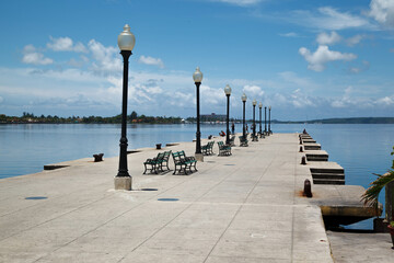 Pier Muelle real with street lamps in Bahia de Cienfuegos, Cienfuegos, Cuba