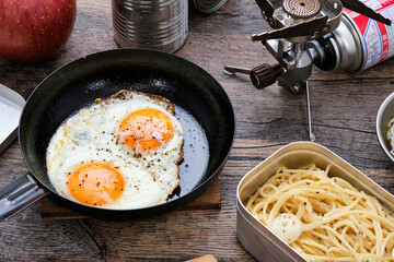 Fried Eggs at Camp on Wooden Table