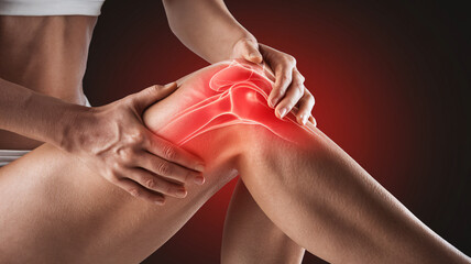 close up photo of a person holding a sore knee