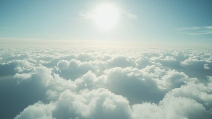 Aerial View of a Sea of Clouds Under a Bright Sun