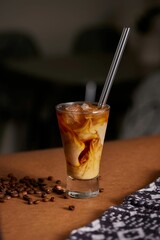 A closeup of an iced milk coffee drink mix