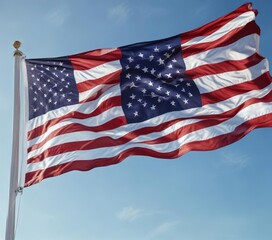 Panoramic image of an American flag waving in the wind against a clear blue sky, usa, wide-angle, landscape, clouds, outdoor