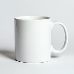 Obraz premium A plain white mug with a smooth finish, positioned on a neutral background, ideal for branding or customization.