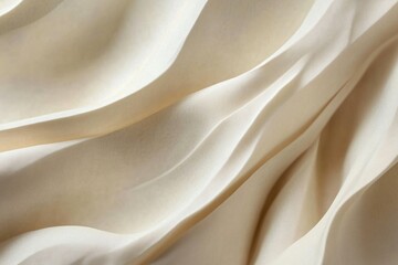 Obraz premium Soft Cream Fabric Waves Draped Elegantly for Textile Background