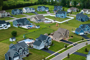 Aerial view of private residential houses in rural suburban sprawl area in Rochester, New York....