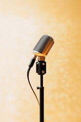 Fototapeta premium A microphone is on a stand in front of a wall