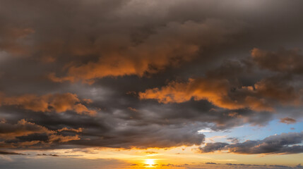 Evening sunset sky with colorful clouds. Panoramic skyscape