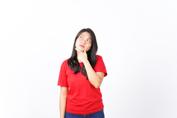 Fototapeta premium Hand on chin looking up and thinking Of Beautiful Asian Woman wearing red shirt Isolated On White Background