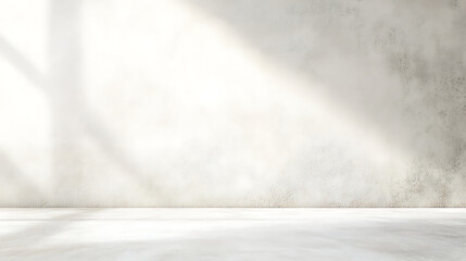 Minimalist interior with a bright, textured wall and soft light casting shadows, creating a serene and inviting atmosphere.