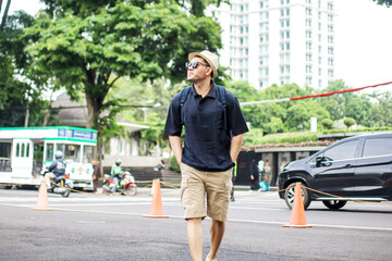 Cheerful Traveler Guy Enjoying Walking on City Street