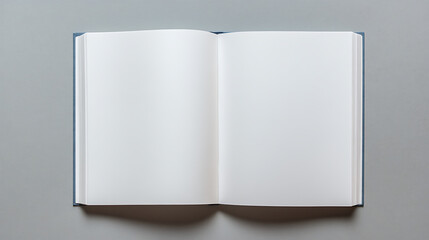 An empty hardcover book lays open on a gray surface, inviting creativity and inspiration. The minimalist design highlights the potential for new ideas.