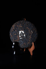 An Intricate Dark Sculpture That Features Fascinating Mirror Elements and Designs