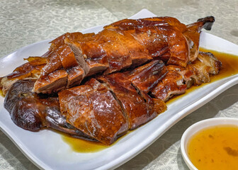 Sliced roasted duck in Hong Kong restaurant on table