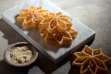 Kembang Goyang is a crispy, flower-shaped Indonesian snack made from rice flour, coconut milk, and sugar, deep-fried using a special mold. Its name means 