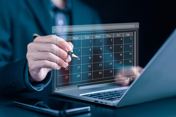 plan schedule calendars online on a laptop, arrange appointment agendas in business and manage...