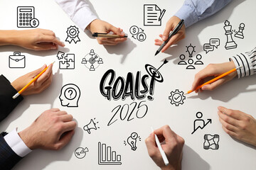Goals 2025, hands of colleagues on a light office table, planning.