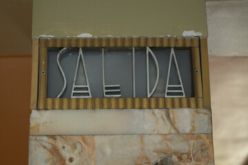 Exit sign in spanish and old letters