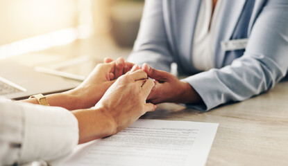 Doctor, patient and holding hands with empathy for consultation, therapy or counseling at clinic....