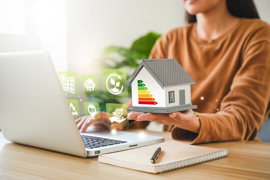 Energy-saving homes, energy efficiency concepts, eco-friendly home improvements, cost savings, low-energy eco-friendly homes, green handshake.