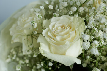 Beautiful bouquet of white roses and gypsophila flowers