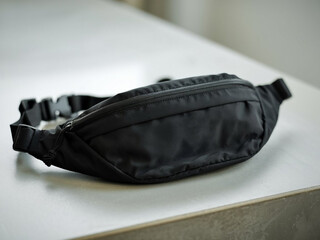 Black blank Fanny pack mockup.Eco friendly stylish trendy Waist pack Zippered Fanny Pack laying flat