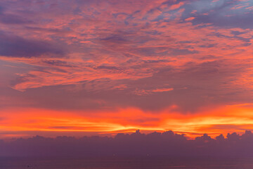 Obraz premium Colourful majestic sunset dramatic sky with cloud on sea shore island summer vacation