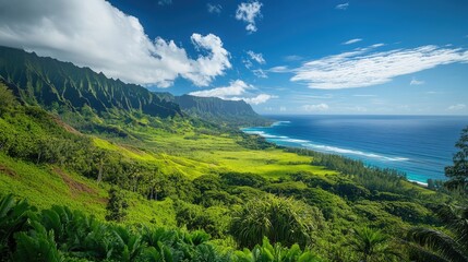 Obraz premium Lush tropical landscape showcasing a vibrant green coast with mountains and a serene ocean view under a bright blue sky