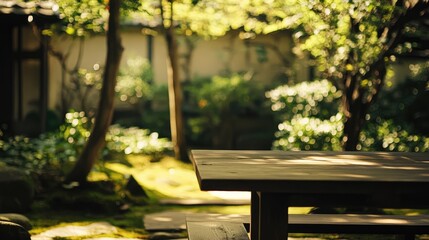 Naklejka premium Tranquil garden setting with wooden table surrounded by lush greenery and natural light. Ideal for relaxation and outdoor dining scenes.