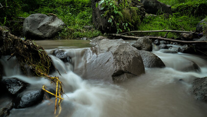 Beautiful silky water at riverside. Slow speed photo shot. Tropical countryside