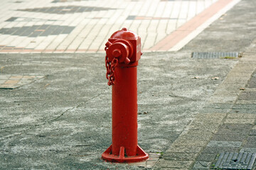 Red fire hydrant on the street.