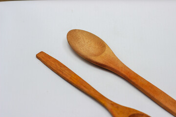 Two wooden spoons with wooden handles. cutlery spoon on white background