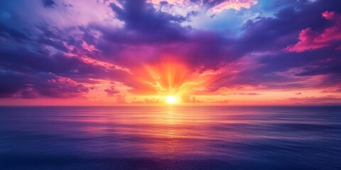 Fototapeta premium Sunset on the ocean creates a stunning display of purple, orange, and blue lights in the sky. The sunset makes monsoon clouds frame the golden sun, with rain falling on the horizon. Dreamy wide shot,