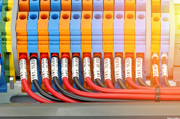 Marking of electrical wires using thermal printing on vinyl tape.