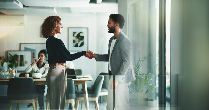 Business, people and happy with handshake at office for meeting, collaboration and agreement on project. Partnership, employees and smile at boardroom for welcome or greeting at brainstorming session
