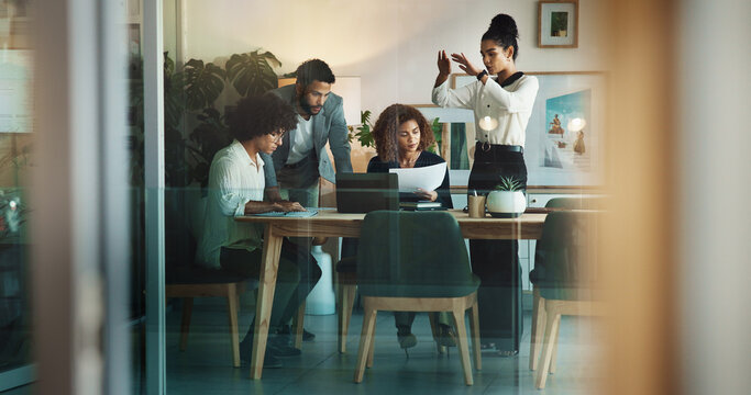 Laptop, planning and business people in meeting, teamwork and communication in modern office. Group, consultant and employees in workplace, conversation and feedback for project, review and research