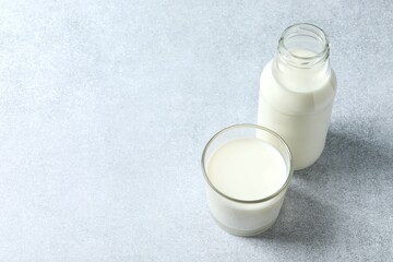 Glass and bottle of milk on the table