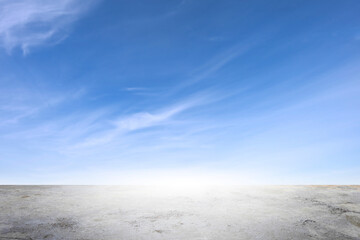 Wide empty grunge cement counter table top on blue sky clouds white light background for business...