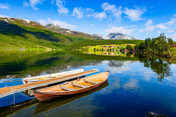 The water reflects blue skies