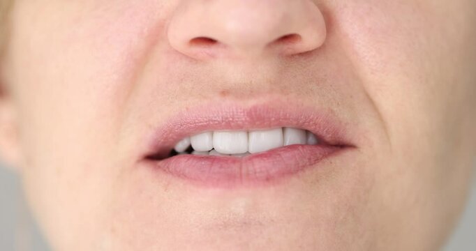 Girl with beautiful white teeth chewing mint gumm
