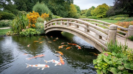 Fototapeta premium The tranquil garden features a gracefully arched stone bridge spanning over a serene koi pond, where vibrant koi fish glide beneath the surface among the lush greenery and blooming flowers.