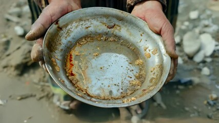 Poverty and hunger: a striking portrayal of a child struggle, harsh reality of economic hardship, global crisis of food insecurity and urgent need to end childhood deprivation worldwide.