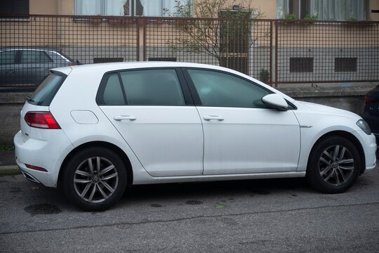 White volkswagen golf gtd parked on street