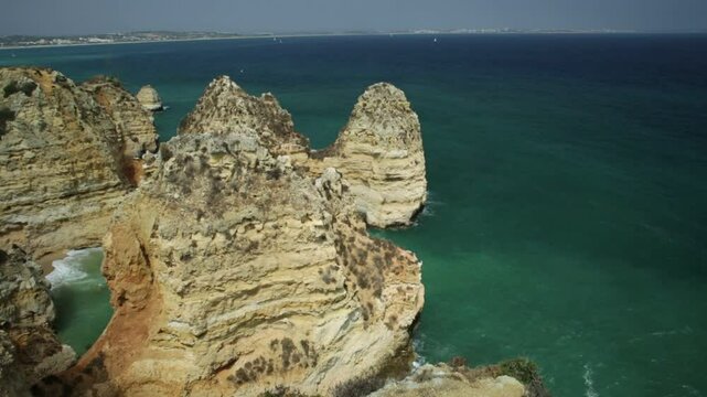Panorama of the 182 steps long stairway to the base of cliffs of Ponta da Piedade in Lagos Bay. Famous tourist attraction in Algarve Coast in Lagos of Portugal.