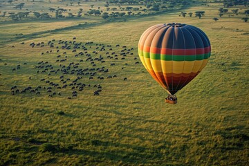 Obraz premium Hot air balloon adventure over the Serengeti at sunrise