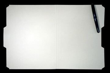 manila file folder with ink pen on black background