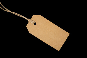 single blank tag with twine on black background