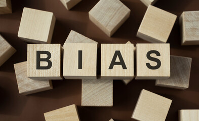 Bias - word from wooden blocks with letters, personal opinions prejudice bias concept, random...
