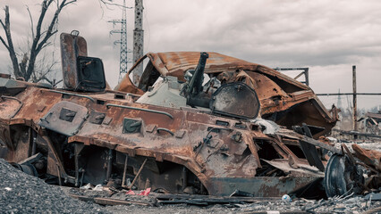 Fototapeta premium damaged and looted military tank in a city in Ukraine