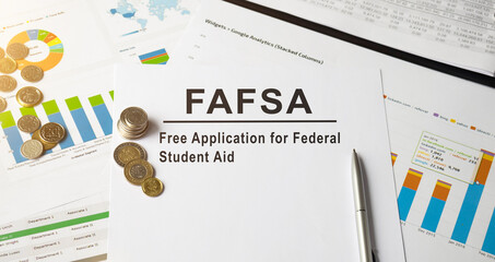 FAFSA inscription on the documents. Business concept